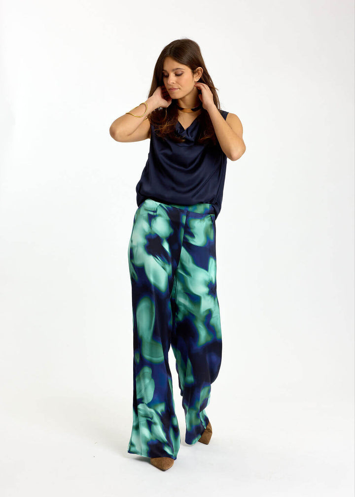 Blue-green abstract print wide-leg trousers with relaxed fit and full-length legs