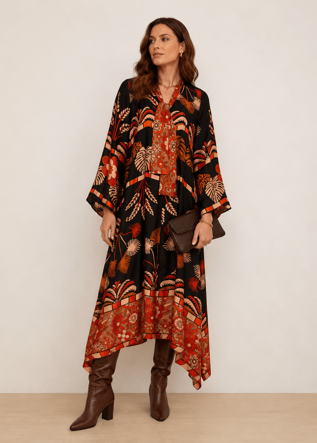 Patterned midi dress with black base, orange and red foliage print, V-neck kimono sleeves