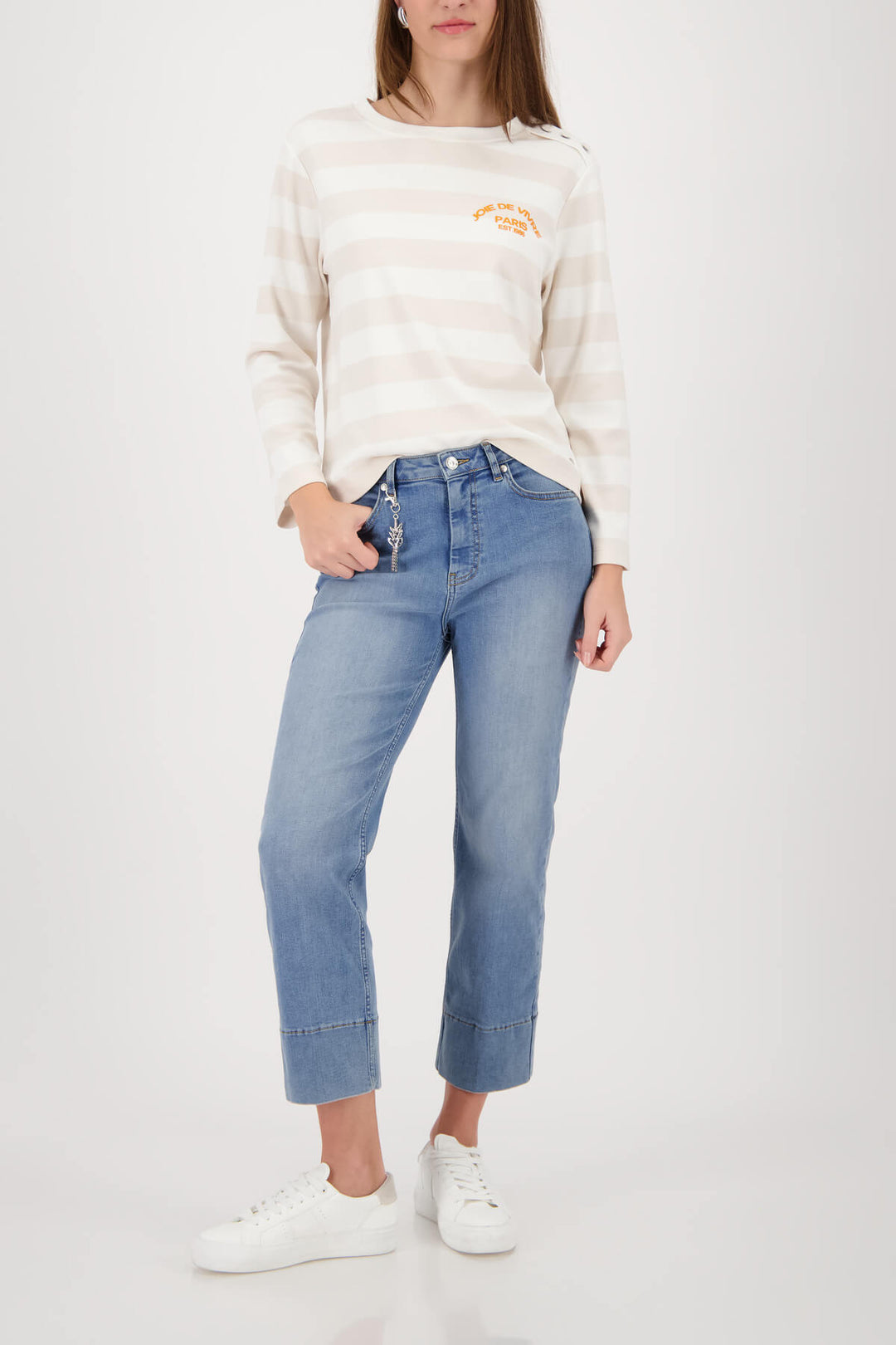 Women’s long-sleeve off-white jersey with light beige horizontal stripes and orange logo