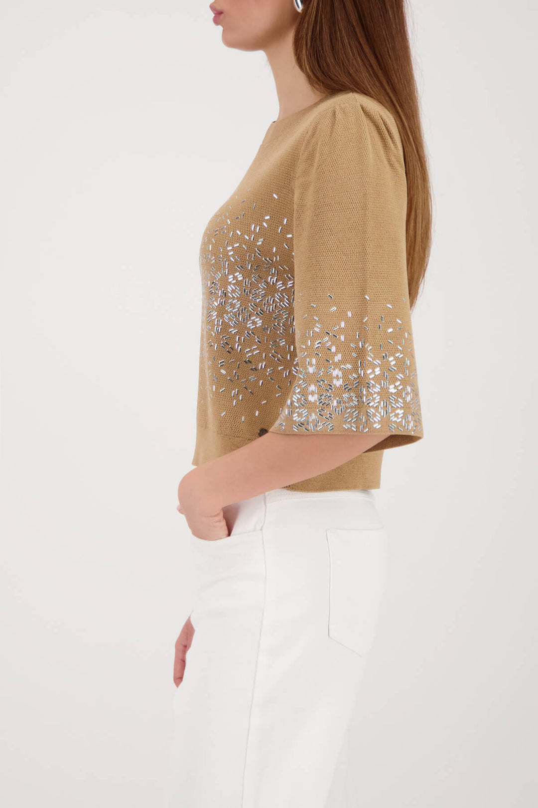 Beige knit top side view with jeweled speckle print and cuffed 3/4 sleeves