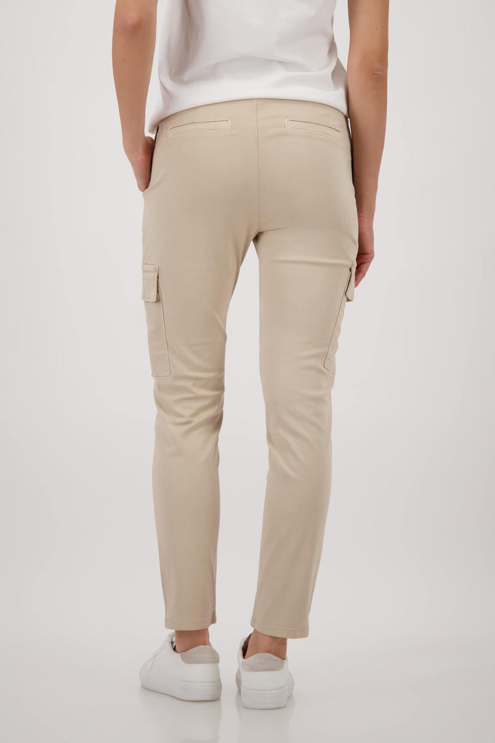 Monari sand cargo pants on model, drawstring waist with thigh cargo pockets. Back view
