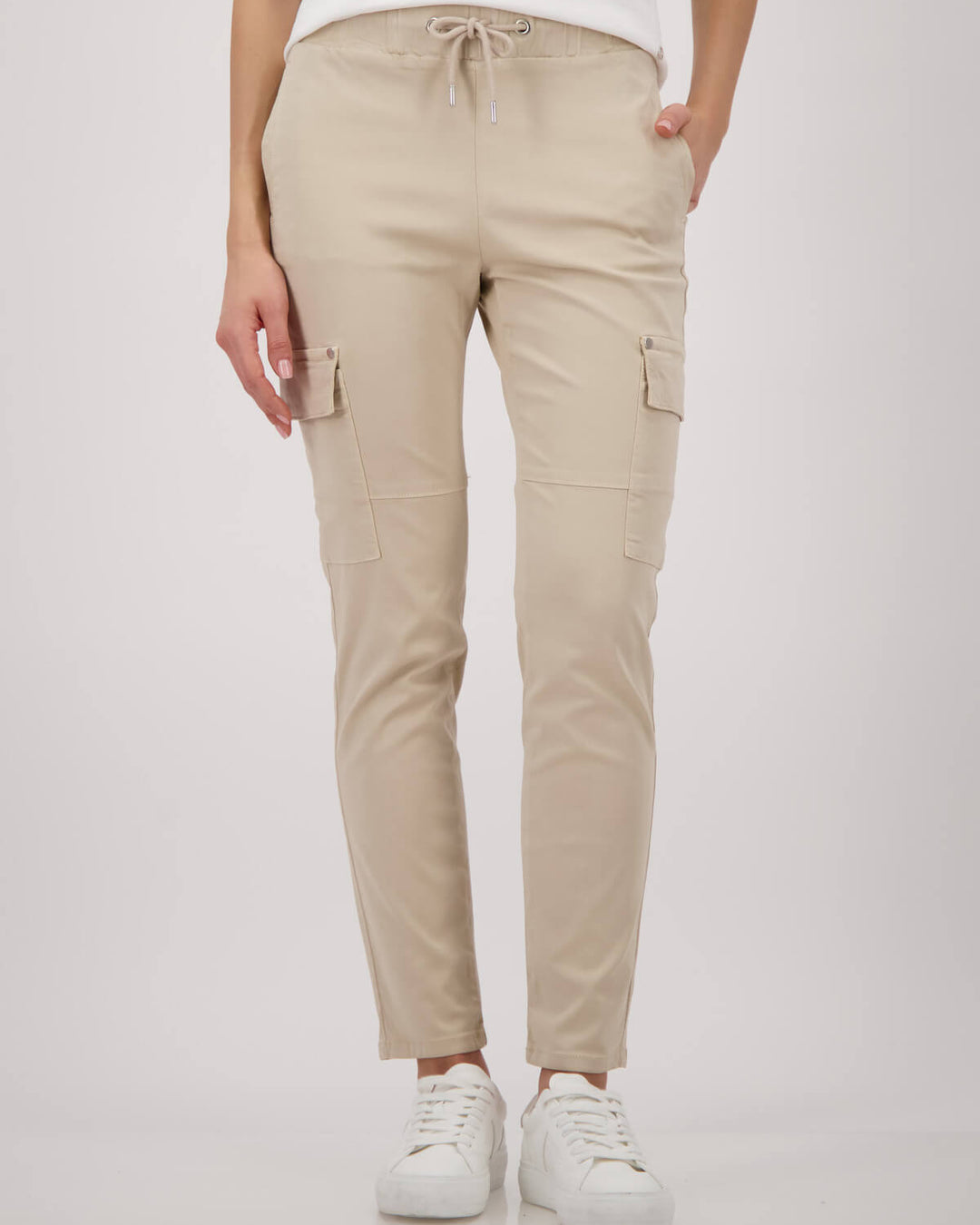 Monari sand cargo pants on model, drawstring waist with thigh cargo pockets