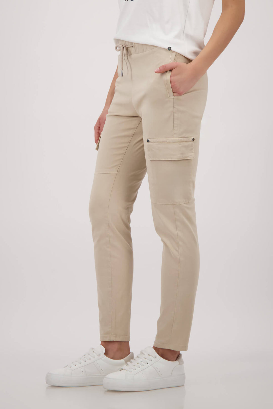 Monari sand cargo pants on model, drawstring waist with thigh cargo pockets