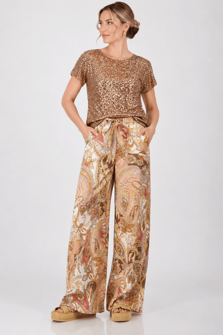 Wide-leg paisley palazzo pants in tan, cream, and brown with relaxed drape