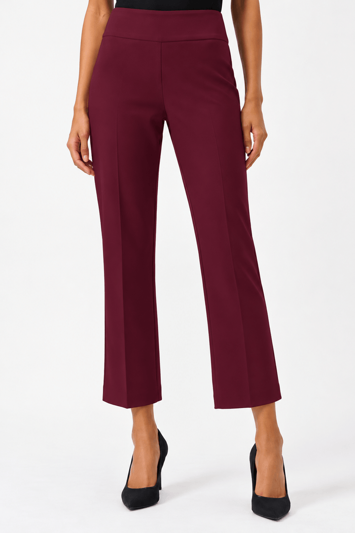 Joseph Ribkoff model wearing high-waisted, straight-leg cropped trousers in a deep burgundy color, paired with black pointed-toe heels, shown against a plain white studio background.