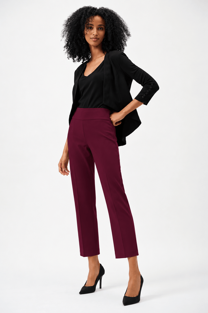 Joseph Ribkoff model wearing high-waisted, straight-leg cropped trousers in a deep burgundy color, paired with black pointed-toe heels, shown against a plain white studio background.