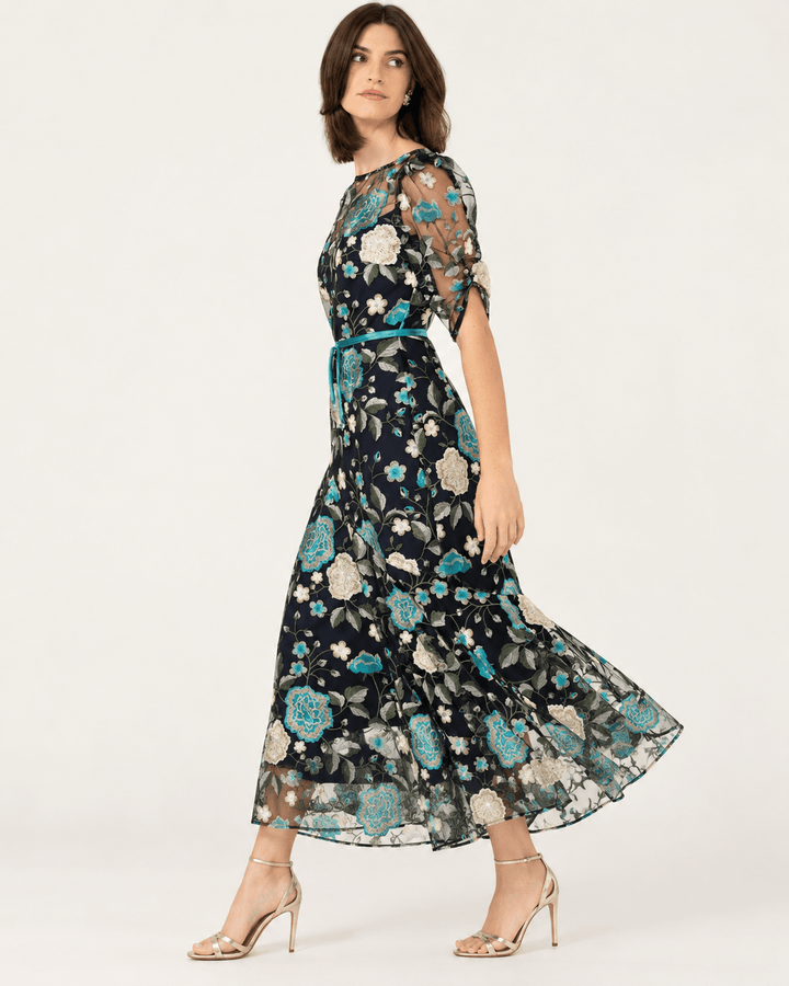Floral mesh lace midi dress with teal, white, and black print; short sleeves, flared skirt
