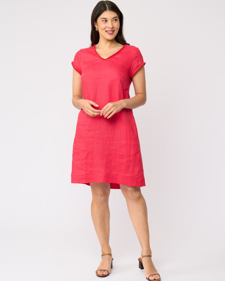 Foil clothing model in a short-sleeve V-neck linen dress in a vibrant pinkish-red color, standing against a plain white studio background.