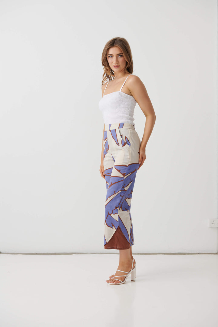 Cream mid-calf pants with lilac and blue palm print