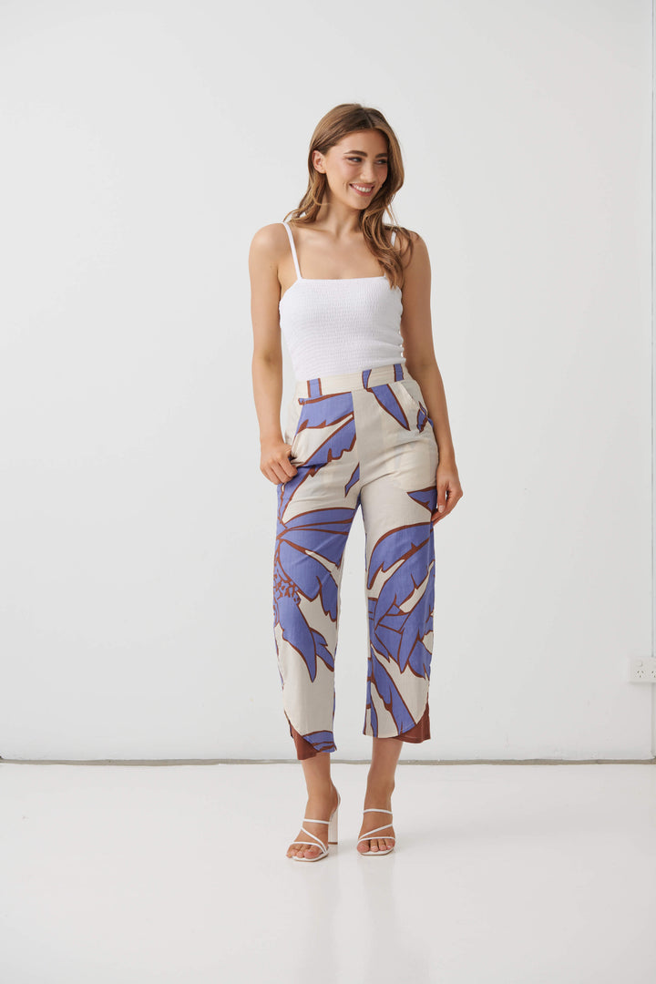 Cream mid-calf pants with lilac and blue palm print, side profile