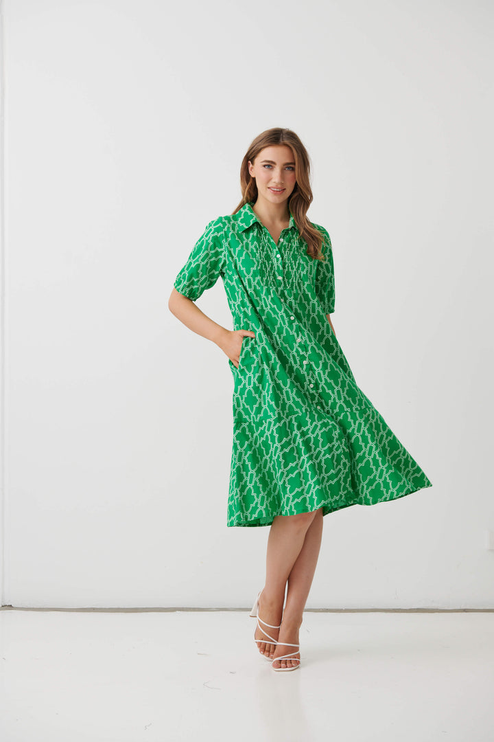 Green patterned button-front midi dress with short sleeves and A-line skirt
