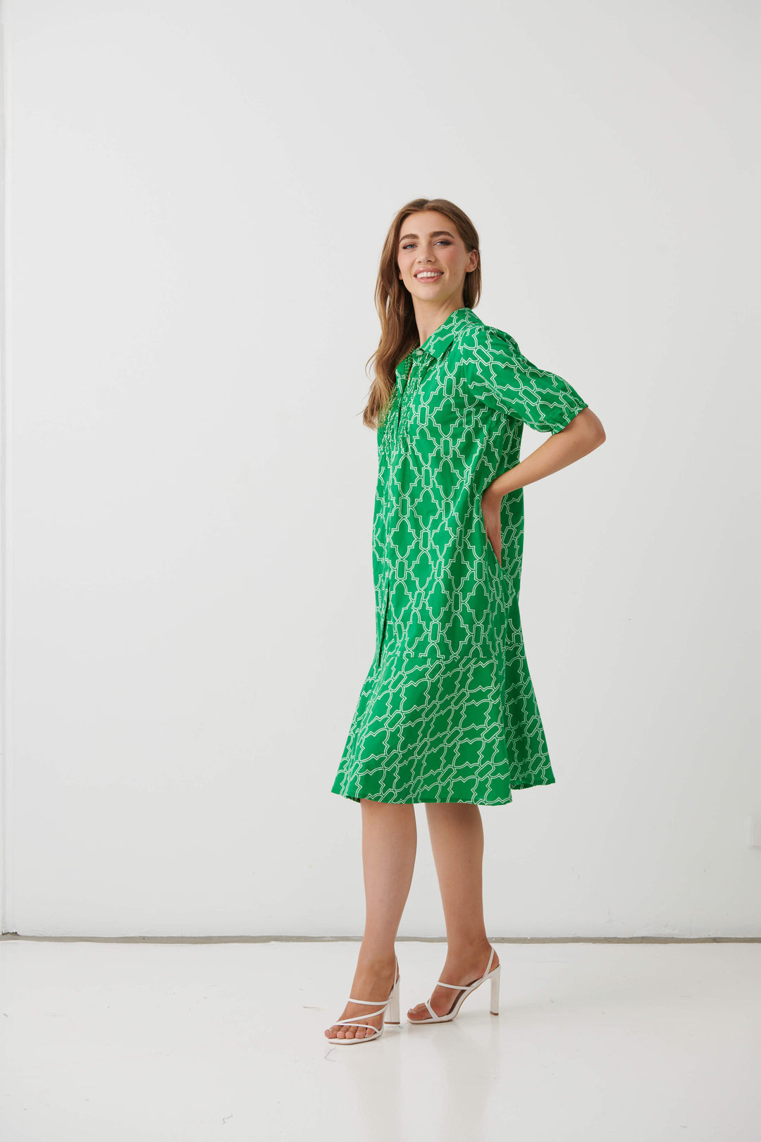 Green patterned button-front midi dress with short sleeves and flared hem