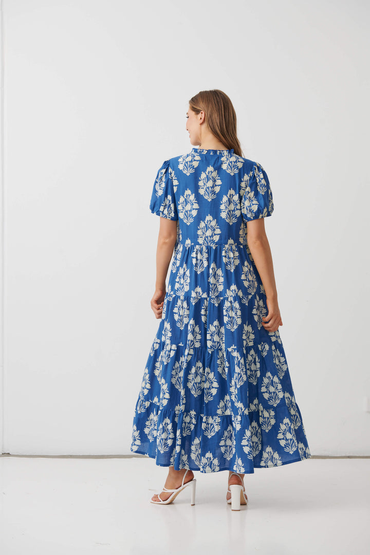 Blue floral maxi dress, short sleeves, back view with tiered skirt
