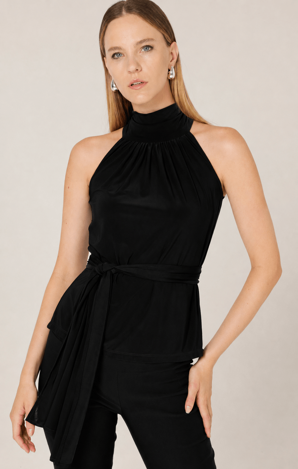 Black sleeveless high-neck tie waist top with pleated front