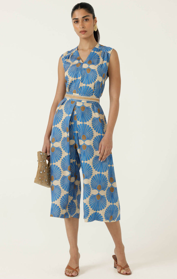 Blue floral sleeveless jumpsuit, V-neckline, belted waist, wide-leg culotte length