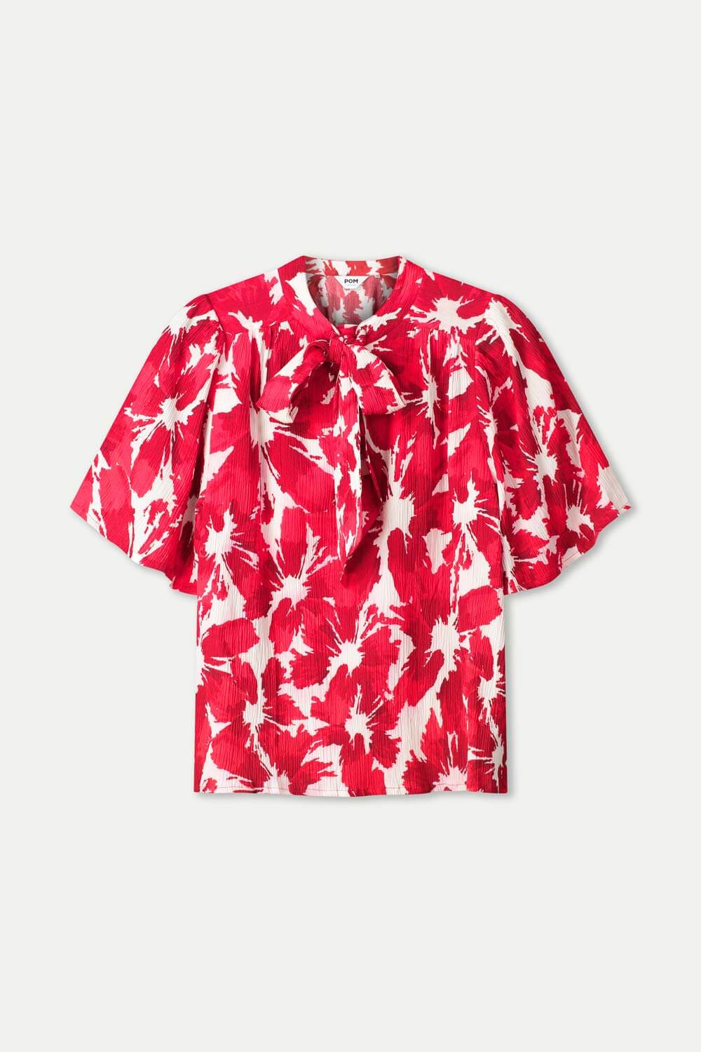 Red and white tie-dye crinkle bubble top with short sleeves and neck ties