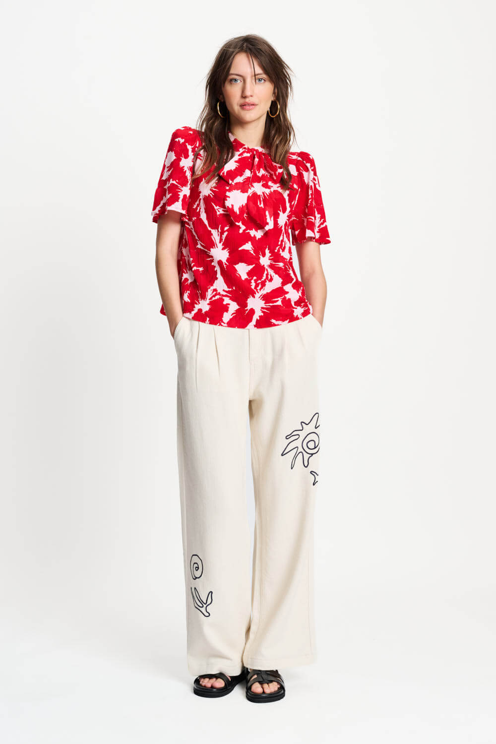 Red and white tie-dye crinkle bubble top with neck tie and short sleeves
