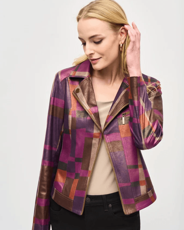 Woman wearing a colorful patterned jacket on a white background