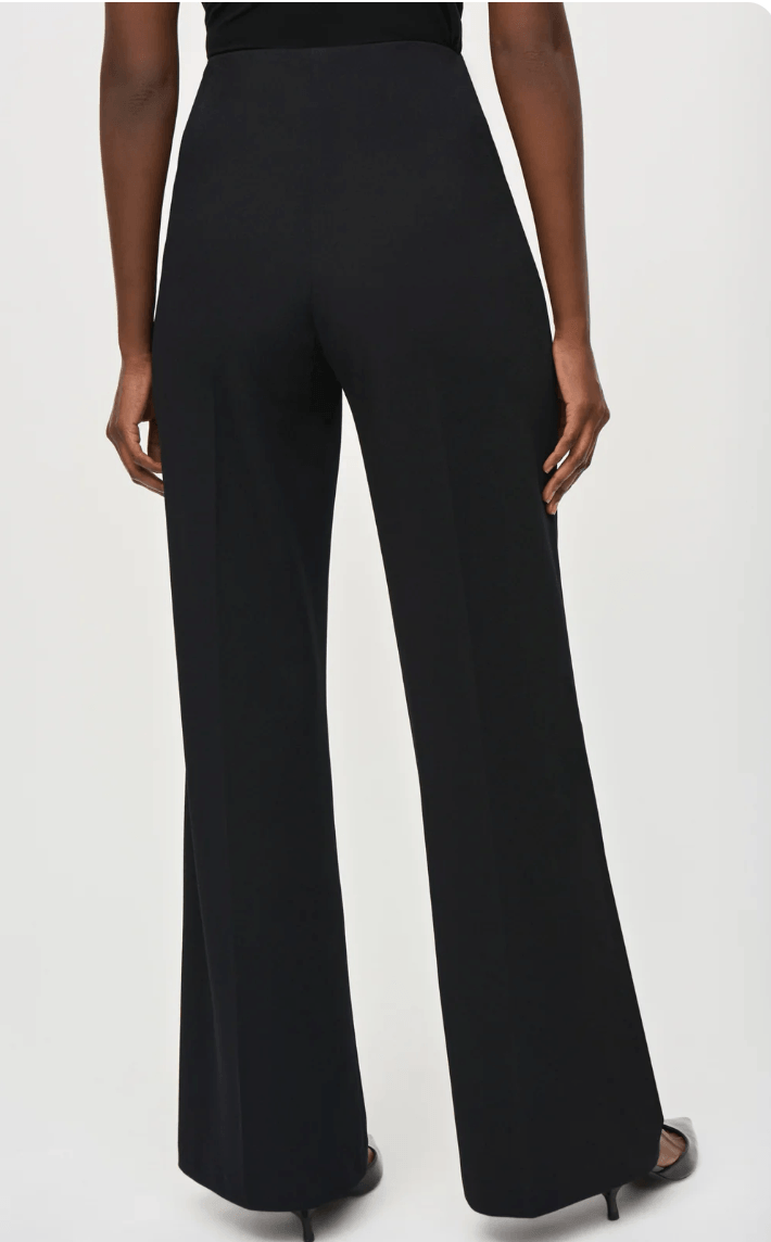 Black wide-leg pants worn by a person on a white background