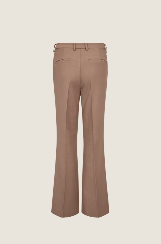 Mos Mosh model wearing a matching taupe brown two-piece suit with a deep V-neck blazer and wide-leg trousers. Flat Image