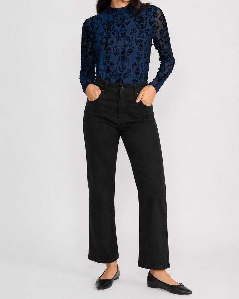 Threadz model in Vicki bootcut jeans, dark black with slight flare and front button-and-zip fly. On a white background 