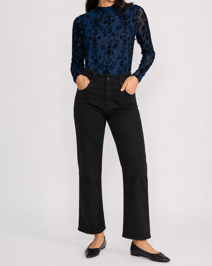 Threadz model in Vicki bootcut jeans, dark black with slight flare and front button-and-zip fly. On a white background 