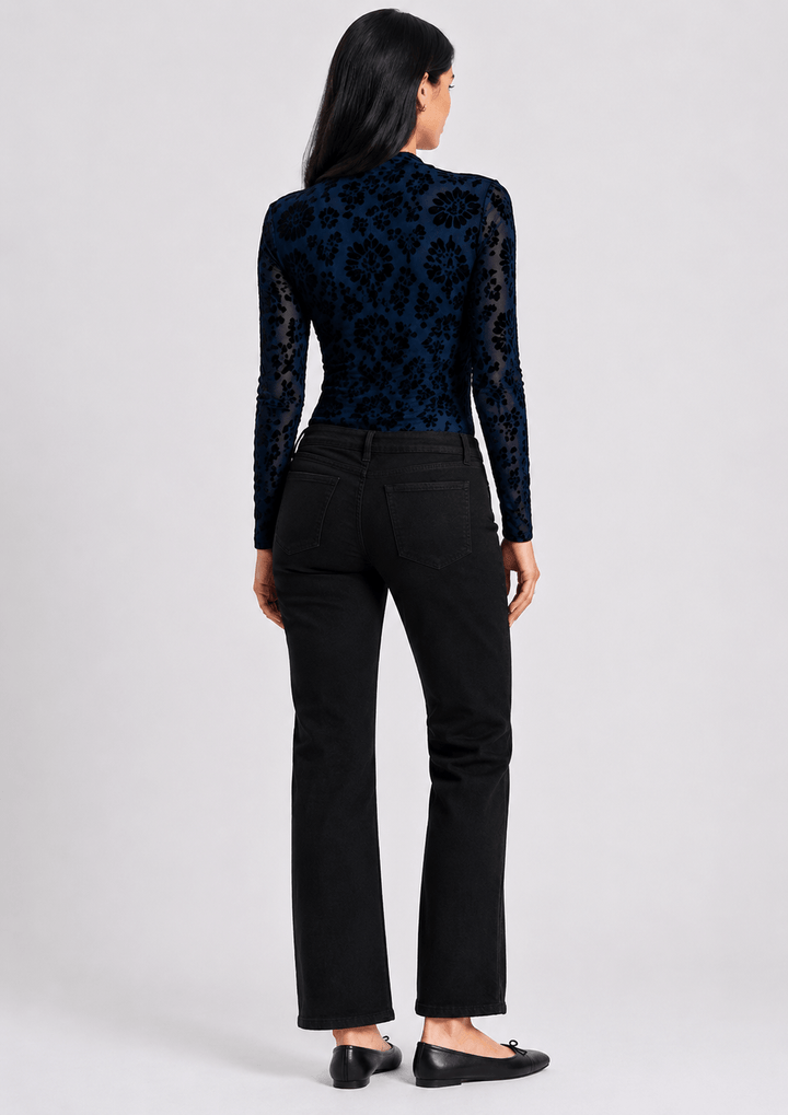 Threadz model in Vicki bootcut jeans, dark black with slight flare and front button-and-zip fly. On a white background . Back view